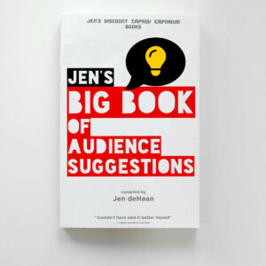 Jen's big book of audience suggestions red and black large display text on white cover. Speech bubble in black with yellow light bulb. Text near bottom saying compiled by Jen deHaan and a pull quote from an improv audience member saying 