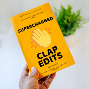 Clap edits book cover. Yellow book being held in a hand with a plant in the backgorund. Large icon of clapping hand. Black text: Supercharged Clap Edits by Jen deHaan with quote 
