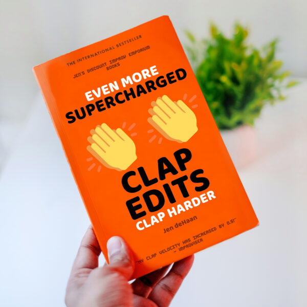 Even More Clap edits clap harder book cover. Red book being held in a hand with a plant in the background. Two large icons of clapping hand. Black text: Even More Supercharged Clap Edits: Clap Harder by Jen deHaan